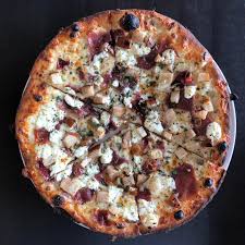 Bistro Bella Vita signature dishes Prosciutto and Pear Pizza, Rustica Pizza, Calamari, Lavender Negroni